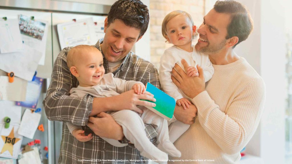 gay couple holding their two babies