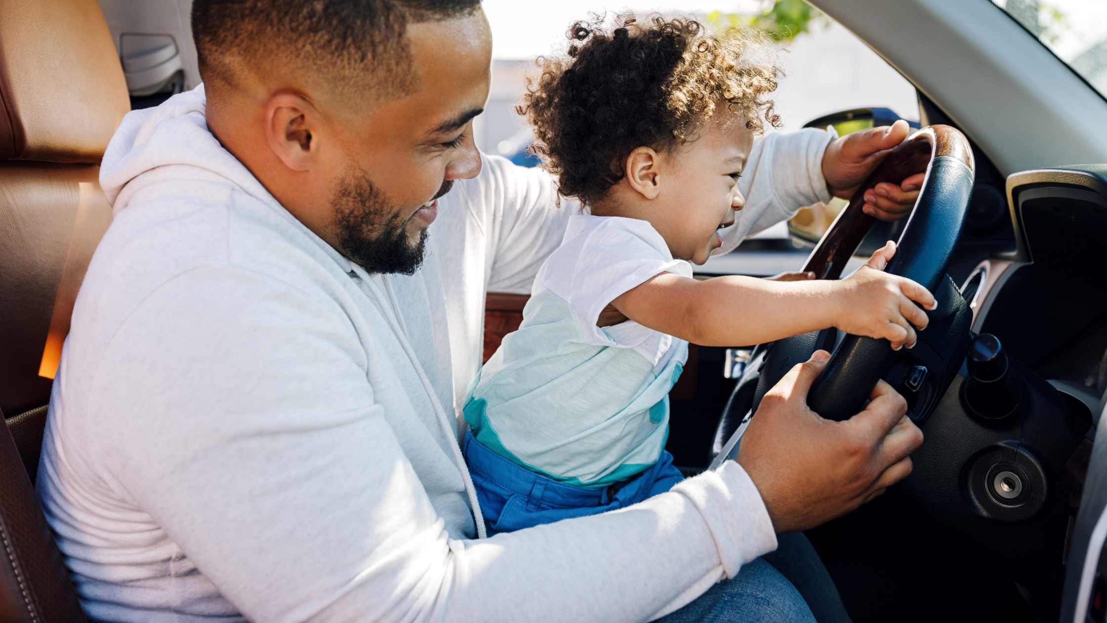 father in a car with his baby girl